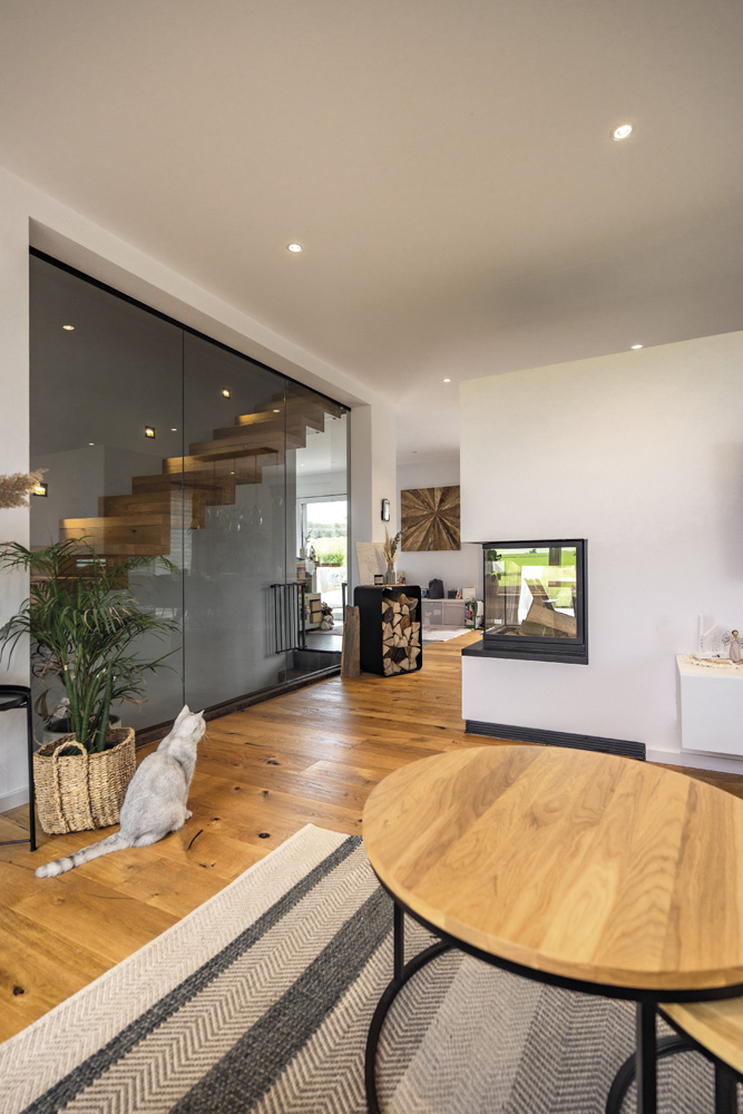 8	Nouvelle construction d’une maison unifamiliale - Séjour avec escalier et cheminée