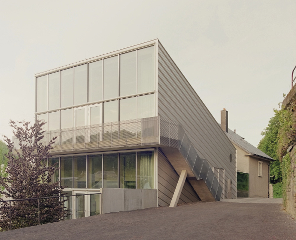 SPEKTRUM: The building engages with the landscape, offering a perspective into the lush valley, and the cement factory